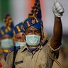 Indian paramilitary soldiers wearing face masks participate in the final dress rehearsals for India's Independence Day celebrations in Gauhati, India, Aug. 13, 2020. 