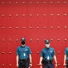 Police officers wearing face masks to help protect against the spread of the coronavirus, stand guard in downtown Seoul, South Korea, Aug. 4, 2020. 