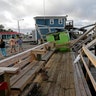 A waterfront dock shows damage following the effects of Hurricane Isaias in Southport, N.C., Tuesday, Aug. 4, 2020.