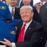 March 21, 2017: Holding up a NASA jacket after signing S. 422, the National Aeronautics and Space Administration Transition Authorization Act.