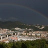 A rainbow shines over the new San Giorgio Bridge in Genoa, Italy, Aug. 3, 2020. 