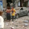 In this frame from video, people walk down the street after an explosion in Beirut Tuesday. Explosions rocked Beirut, inflicting many injuries and damaging buildings in a large radius around the city’s port.