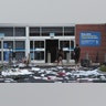 People load walk out of a looted Best Buy store after parts of the city had widespread looting and vandalism, on Aug. 10, 2020 in Chicago, Ill.