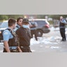 Police officers detain a man who was found inside of a Best Buy store after parts of the city had widespread looting and vandalism, on Aug. 10, 2020 in Chicago, Ill. Police made several arrests during the night of unrest and recovered at least one firearm.