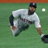 Boston Red Sox center fielder Jackie Bradley Jr. makes a diving catch on a flyout by Tampa Bay Rays' Brandon Lowe during the third inning of a baseball game in St. Petersburg, Florida, Aug. 4, 2020. 