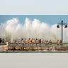 Curious residents of Key West, Fla., flock to the Edward B. Knight Pier Monday, Aug. 24, 2020, to witness the wind and wave action of Hurricane Laura as the storm passes well to the west of the Florida Keys. (Rob O'Neal/The Key West Citizen via AP)
