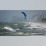 A kite surfer enjoys the wind in Lauderdale, Fla., Monday, Aug. 24, 2020. Tropical Storm Marco began falling apart Monday, easing one threat to the Gulf Coast but setting the stage for the arrival of Laura as a potentially supercharged Category 3 hurricane with winds topping 110 mph (177 kph). (Joe Cavaretta/South Florida Sun-Sentinel via AP)
