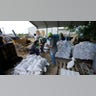 Municipal workers fill sandbags for the elderly and those with disabilities ahead of Hurricane Laura in Crowley, La., Tuesday, Aug. 25, 2020. (AP Photo/Gerald Herbert)