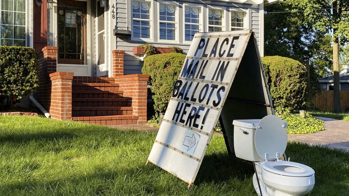 This political yard display was recently set up on West Columbia Street in Mason, Mich. (Matthew Dae Smith/Lansing State Journal via AP)