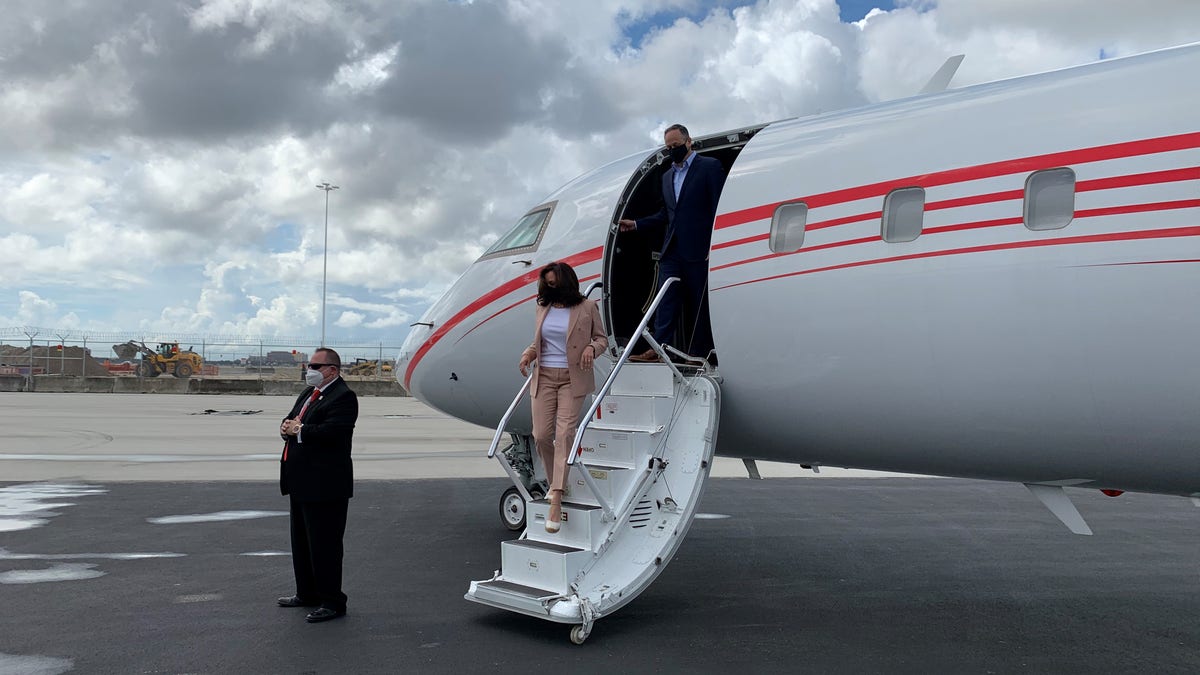 Democratic vice presidential nominee Sen. Kamala Harris and her husband Doug Emhoff arrive at Miami International Airport in Florida on Thursday, Sept. 10, 2020