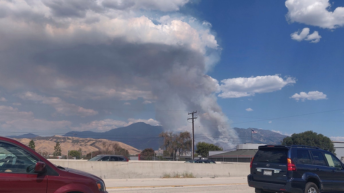 A plume of smoke from the El Dorado Fire is seen from the Interstate 10 in Loma Linda, Calif., Saturday, Sept. 5, 2020.? (AP Photo/Ringo H.W. Chiu)