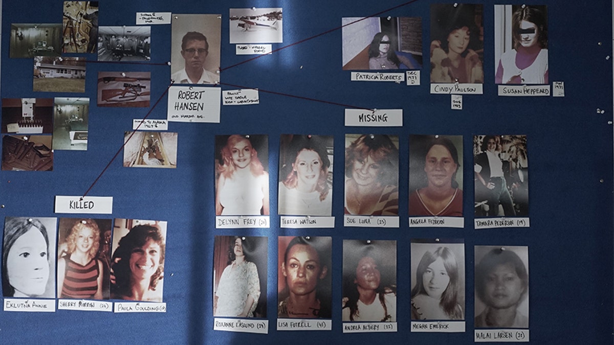 The murder and missing board showing photos of Hansen’s victims and crime scene photos.