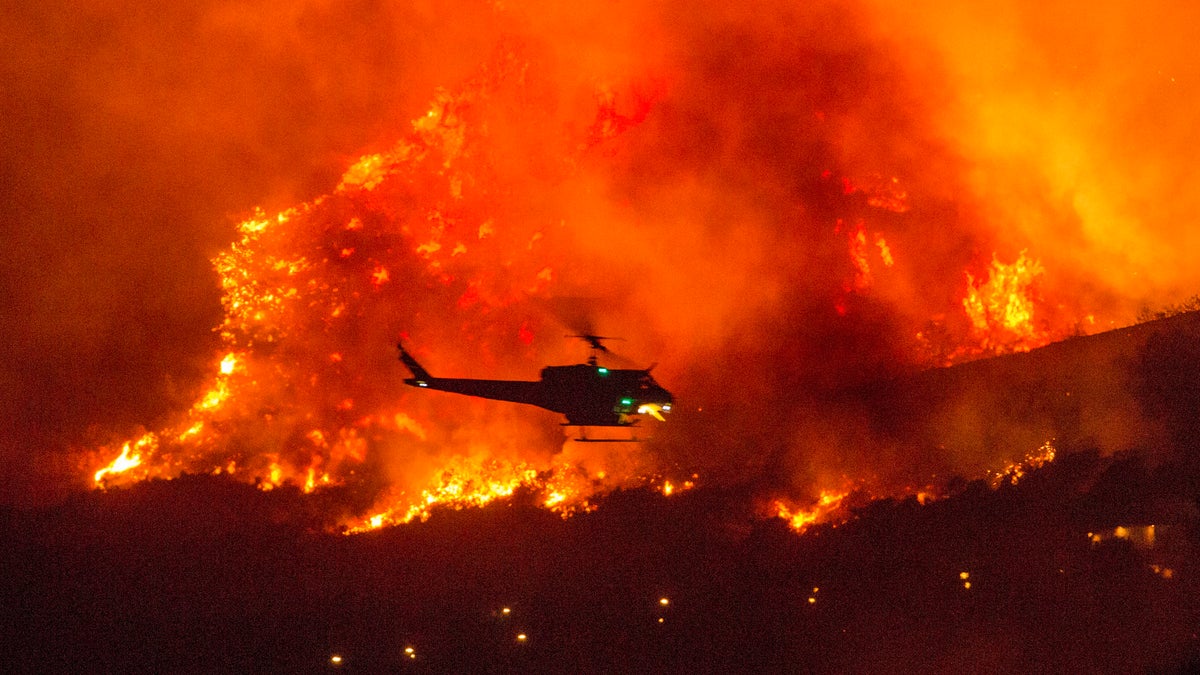 Helicopter flying through wildfire