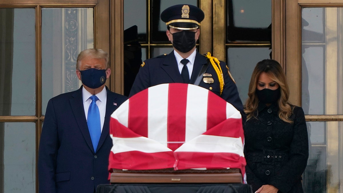 President Donald Trump and first lady Melania Trump pay respects as Justice Ruth Bader Ginsburg lies in repose at the Supreme Court building on Thursday, Sept. 24, 2020, in Washington. Ginsburg, 87, died of cancer on Sept. 18. (AP Photo/J. Scott Applewhite)