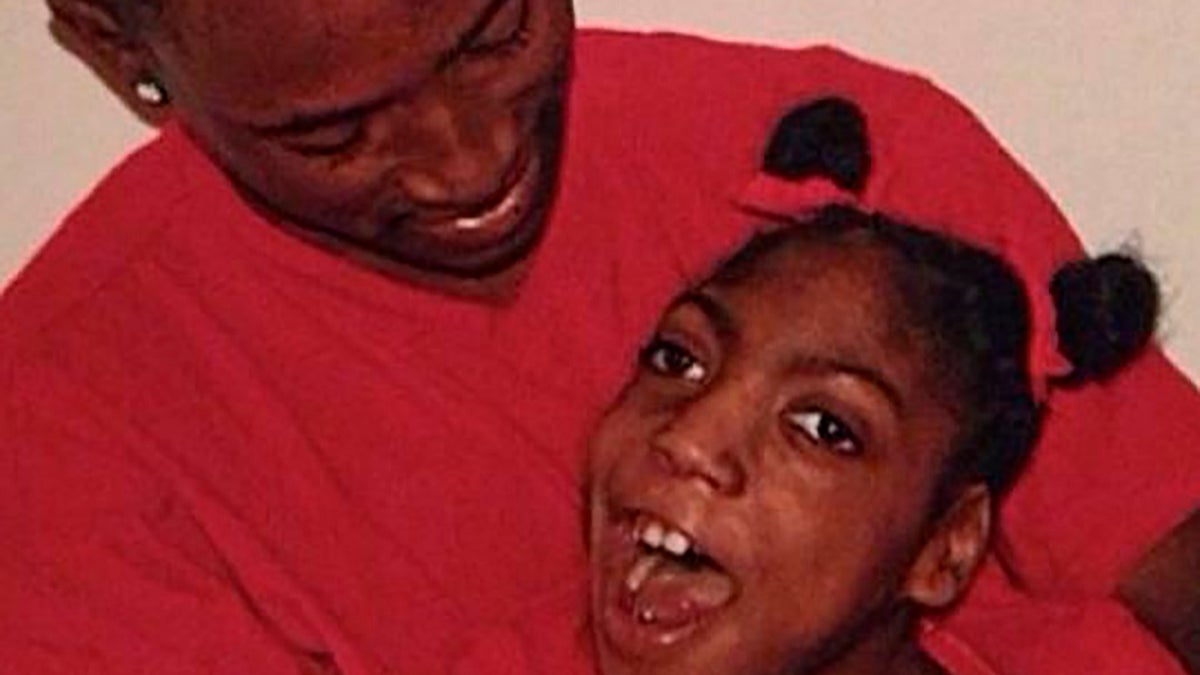Timesha Beauchamp with her brother Steven Thompson in Southfield, Mich.. (Courtesy Erica Lattimore through Fieger Law via AP)