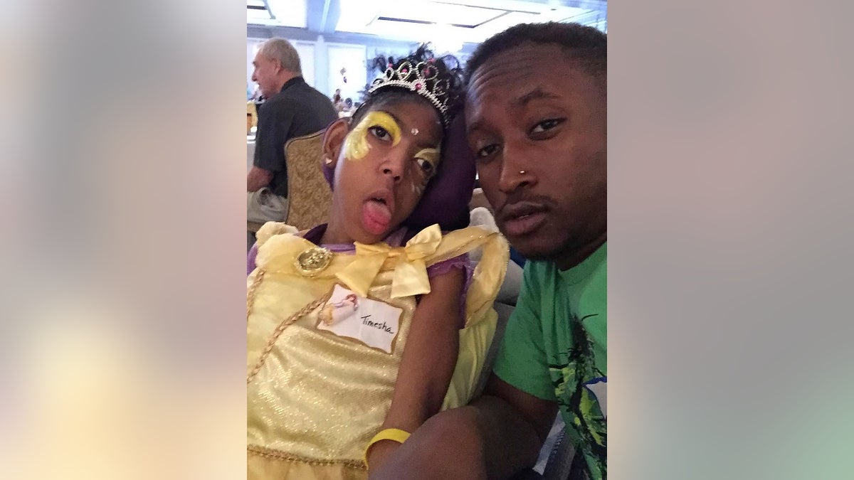 Timesha Beauchamp with her brother Steven Thompson in Southfield, Mich. (Courtesy Erica Lattimore through Fieger Law via AP)
