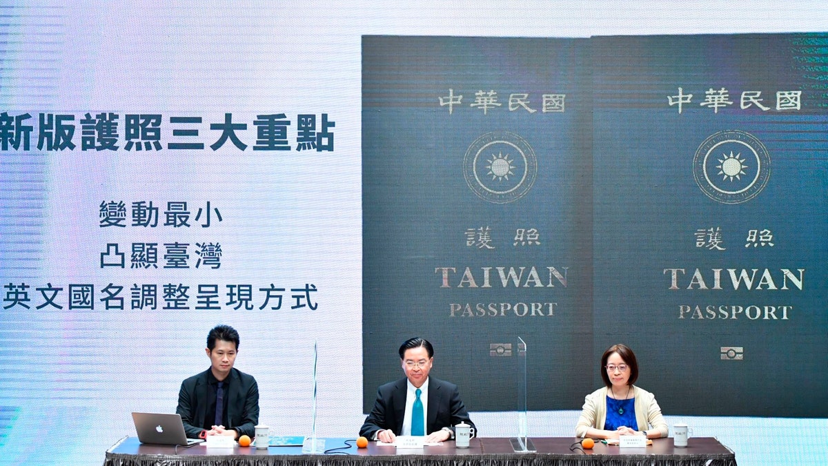In this Sep. 2, 2020, photo released by the Executive Yuan, Taiwan's Foreign Minister Joseph Wu, center, and Executive Yuan spokesperson Evian Ting, left, and Director of Consular Affairs Bureau Phoebe Yeh attends a news conference to reveal the new Taiwan passport in Taipei, Taiwan. (Executive Yuan via AP)