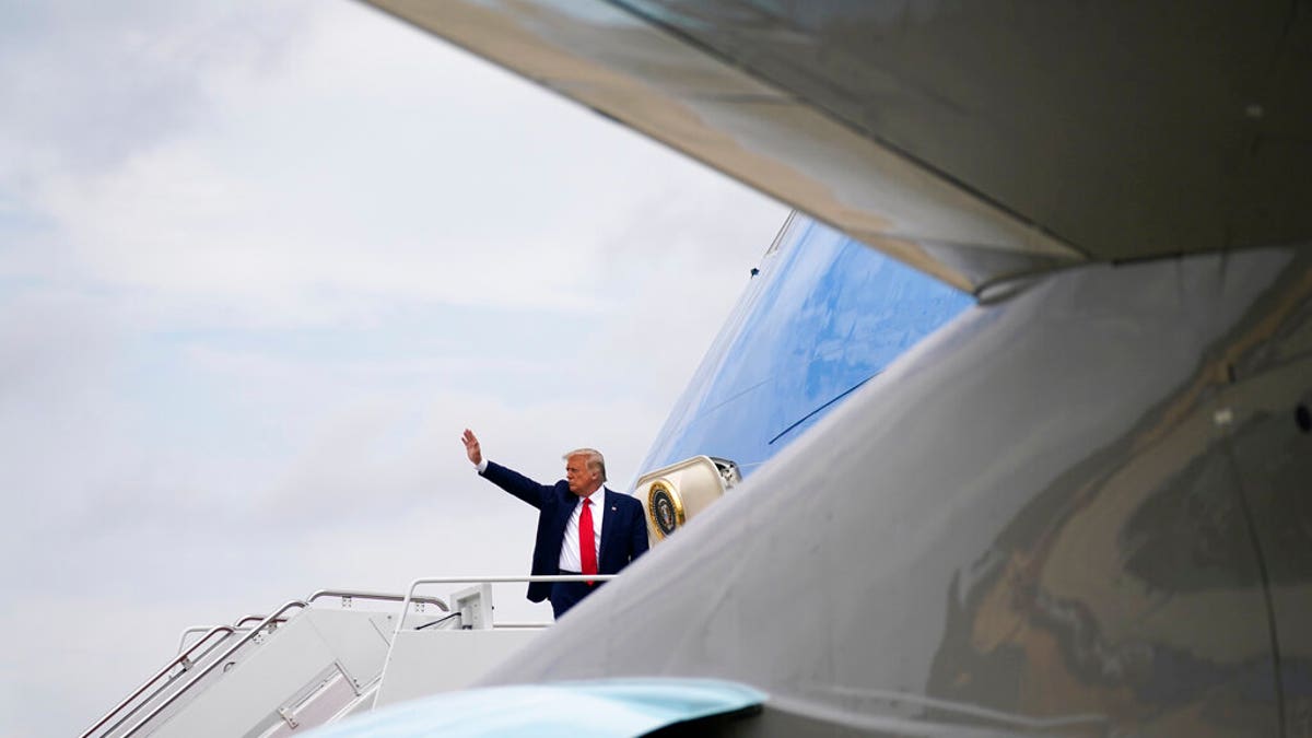 President Donald Trump waves as he boards Air Force One for a trip to Wilmington, N.C., Wednesday, Sept. 2, 2020, in Andrews Air Force Base, Md. (AP Photo/Evan Vucci)