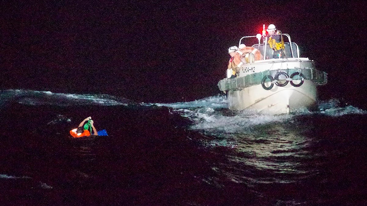 In this photo released by the 10th Regional Japan Coast Guard Headquarters, a Filipino crewmember of a Panamanian cargo ship is rescued by Japanese Coast Guard members in the waters off the Amami Oshima, Japan Wednesday, Sept. 2, 2020. Japanese rescuers have safely plucked the crewmember from the sea while searching for the cargo ship carrying more than 40 crew and thousands of cows went missing after sending a distress call off the southern Japanese island. (The 10th Regional Japan Coast Guard Headquarters via AP)