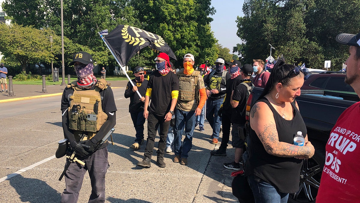 Members of the right-wing group the Proud Boys arrive in Salem, Ore., on Monday Sept. 7, 2020 for a pro-Donald Trump rally at the Capitol. (AP Photo/Andrew Selsky)