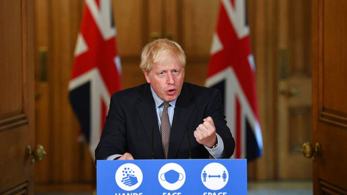 Britain's Prime Minister Boris Johnson speaks during a virtual press conference at Downing Street, London, Wednesday Sept. 9, 2020, following the announcement that the legal limit on social gatherings is set to be reduced from 30 people to six. (Stefan Rousseau/Pool via AP)