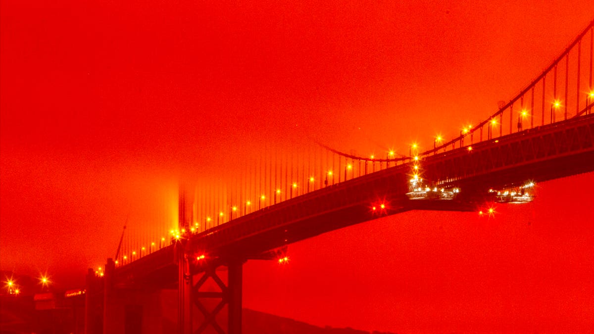 The Golden Gate Bridge at 11 a.m. Wednesday, Sept. 9, 2020, in San Francisco, amid a smoky, orange haze caused by the ongoing wildfires. (Frederic Larson via AP)