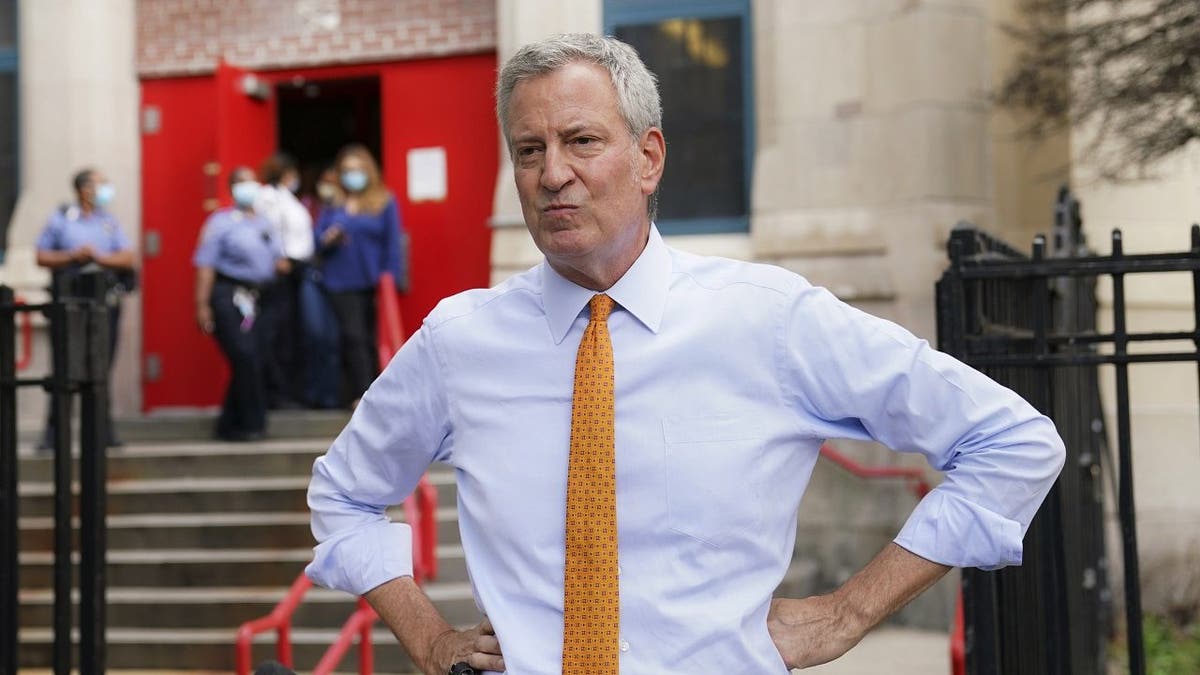 In this Aug. 19, 2020, file photo, New York Mayor Bill de Blasio speaks to reporters after visiting New Bridges Elementary School in the Brooklyn borough of New York, to observe pandemic-related safety procedures. (AP Photo/John Minchillo)