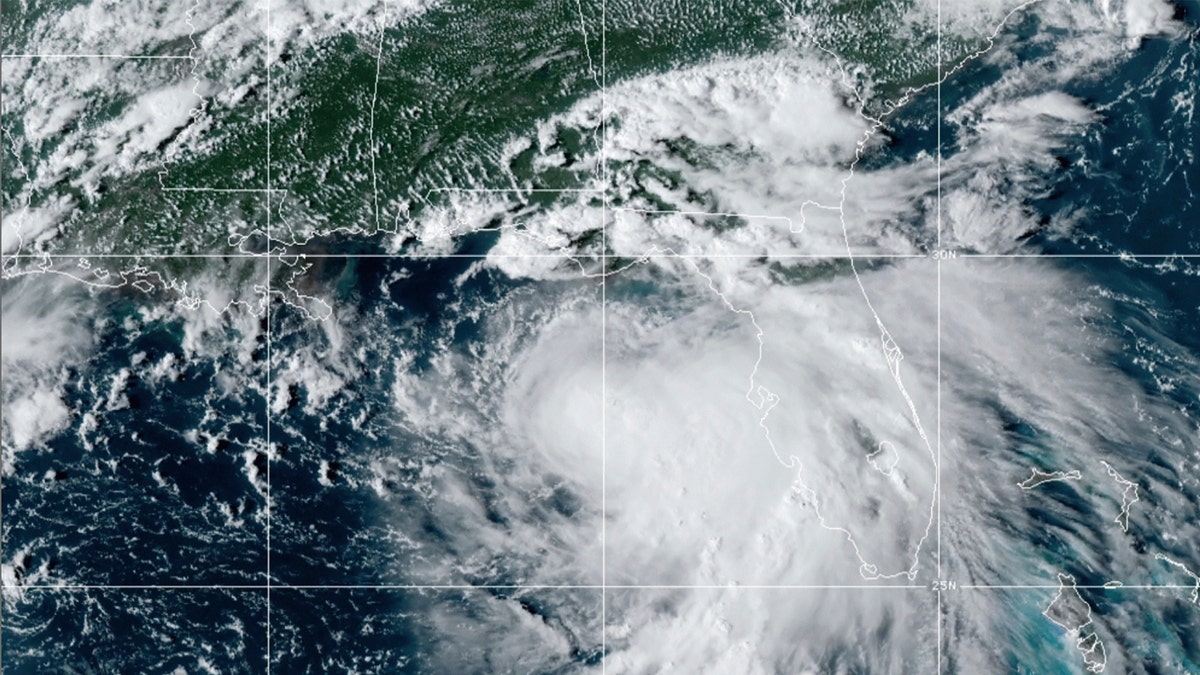This satellite photo provided by the National Oceanic and Atmospheric Administration shows Tropical Storm Sally, Sunday, Sept. 13, 2020, at 2050 GMT. Sally churned northward on Sunday, poised to turn into a hurricane and send a life-threatening storm surge along the northern Gulf of Mexico. (NOAA via AP)