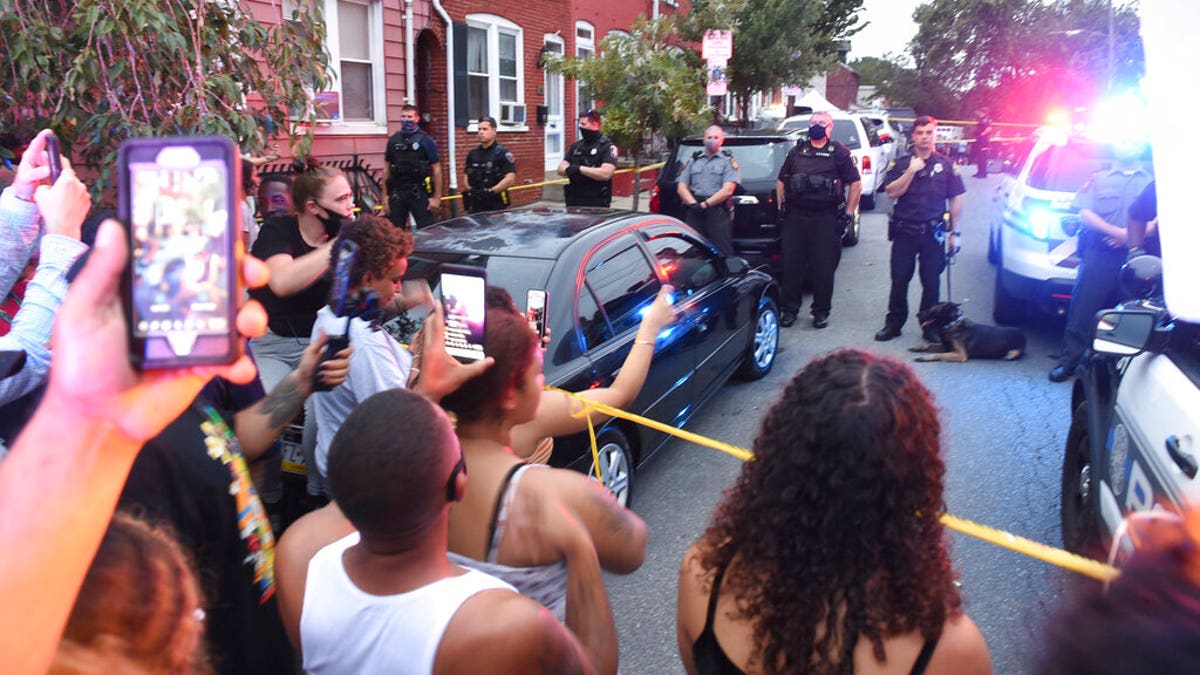 People chant during a protest at the scene of a police shooting on Laurel Street and Union Street in Lancaster city on Sunday, Sept. 13, 2020.