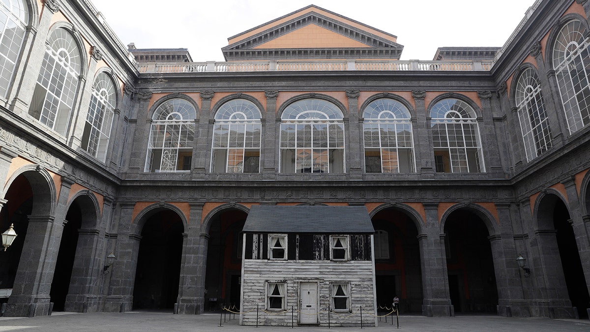 The house of U.S. civil rights campaigner Rosa Parks, rebuilt by artist Ryan Mendoza, is on display in the courtyard of an 18th century Royal Palace, in Naples, Italy, Tuesday, Sept. 15, 2020. It’s the latest stop for the house in a years-long saga that began when Parks’ niece saved the tiny two-story home from demolition in Detroit after the 2008 financial crisis. (AP Photo/Gregorio Borgia)
