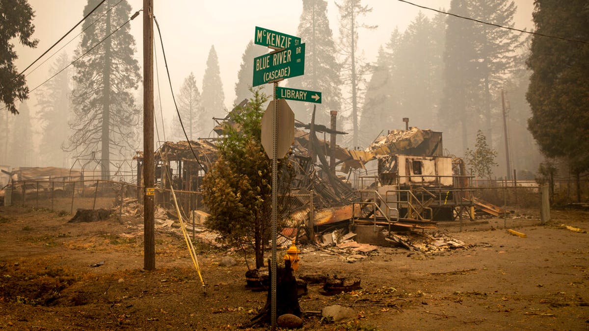 Land and property at an intersection is scorched, Sept. 15, in Blue River, Ore., eight days after the Holiday Farm Fire swept through the area's business district. More than 300 structures have been destroyed in the fire. (Andy Nelson/The Register-Guard via AP, Pool)