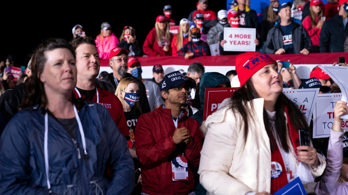 Supporters of President Donald Trump listen as he speaks during a campaign rally at Central Wisconsin Airport, Thursday, Sept. 17, 2020, in Mosinee, Wis. (AP Photo/Evan Vucci)