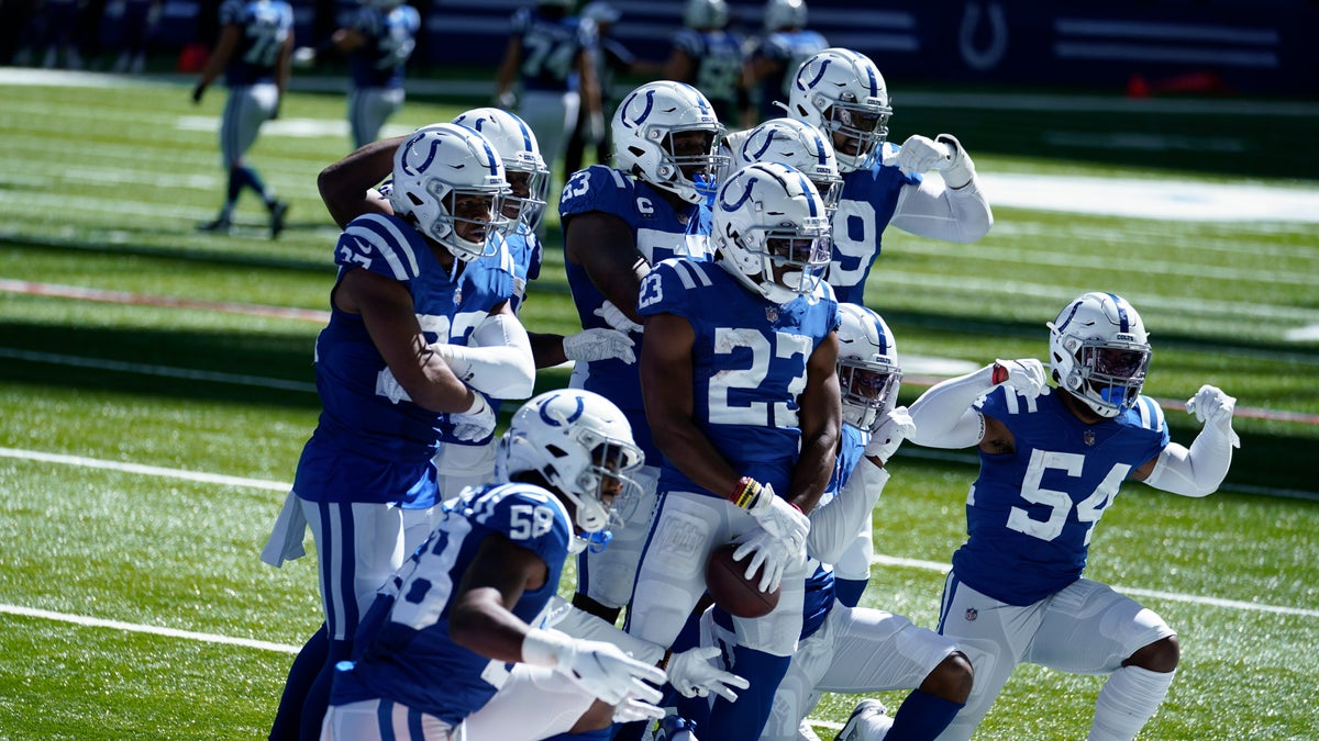 Indianapolis Colts' Kenny Moore II (23) celebrates an interception with teammates during the second half of an NFL football game against the Minnesota Vikings, Sunday, Sept. 20, 2020, in Indianapolis. (AP Photo/Michael Conroy)