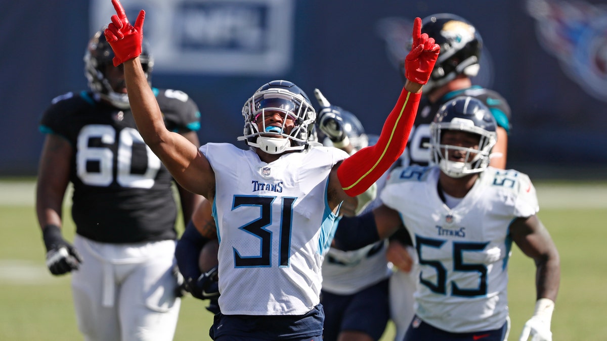 Tennessee Titans free safety Kevin Byard (31) celebrates after teammate Harold Landry intercepted a pass to stop the final drive of the Jacksonville Jaguars in the fourth quarter of an NFL football game Sunday, Sept. 20, 2020, in Nashville, Tenn. The Titans won 33-30.(AP Photo/Wade Payne)