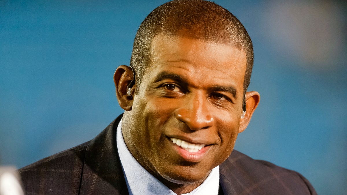FILE - In this Oct. 12, 2017, file photo, Thursday Night Football analyst Deion Sanders gives his take before an NFL football game between the Philadelphia Eagles and Carolina Panthers in Charlotte, N.C. Hall of Fame cornerback Deion Sanders says he will become Jackson State's football coach. (AP Photo/Bob Leverone)