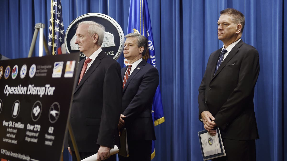 Deputy Attorney General Jeffrey Rosen, announces a worldwide crackdown on opioid trafficking on the darknet with FBI Director Christopher Wray, center, and DEA Acting Administrator Timothy Shea, on Sept. 22, 2020, in Washington. (Olivier Douliery/Pool via AP)