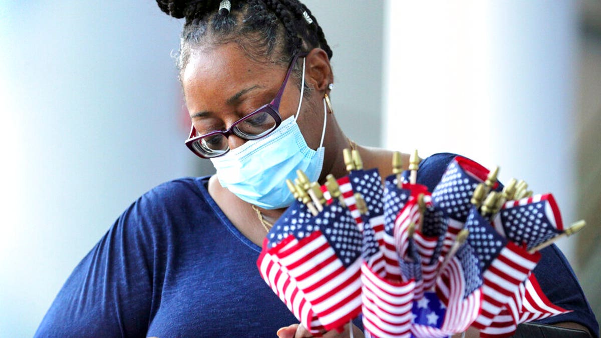 Parramore neighborhood resident Francina Fountain registers to vote during the National Voter Registration Day event hosted by the Orlando Magic, in Orlando, Fla., Tuesday, September 22, 2020.