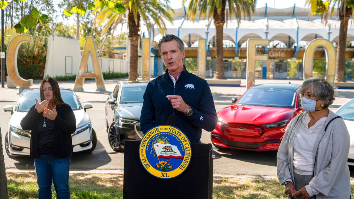 California Gov. Gavin Newsom speaks at a press conference on Wednesday, Sept. 23, 2020, at Cal Expo in Sacramento where he announced an executive order requiring the sale of all new passenger vehicles to be zero-emission by 2035. (Daniel Kim/The Sacramento Bee via AP, Pool)