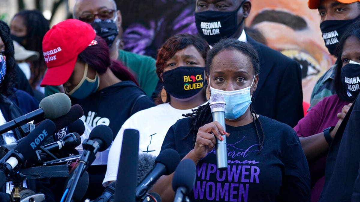 State Rep. Attica Scott speaks during a news conference, Friday, Sept. 25, 2020, in Louisville, Ky. (AP Photo/Darron Cummings)
