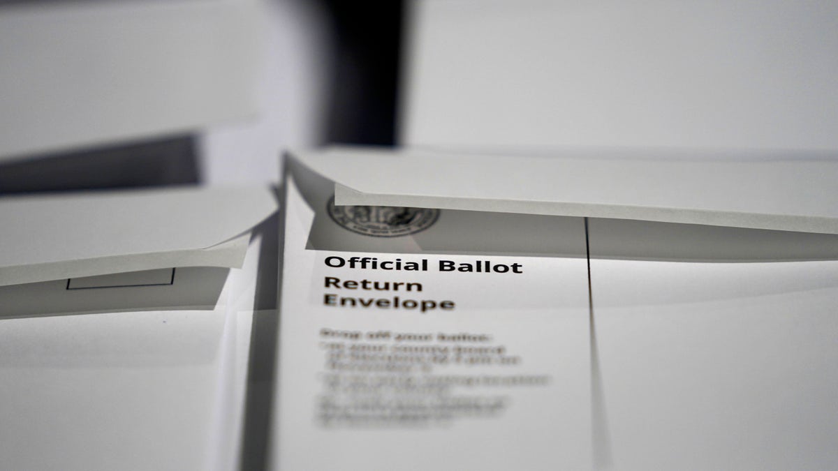 Stacks of ballot envelopes waiting to be mailed are seen at the Wake County Board of Elections in Raleigh, N.C. (AP Photo/Gerry Broome, File)