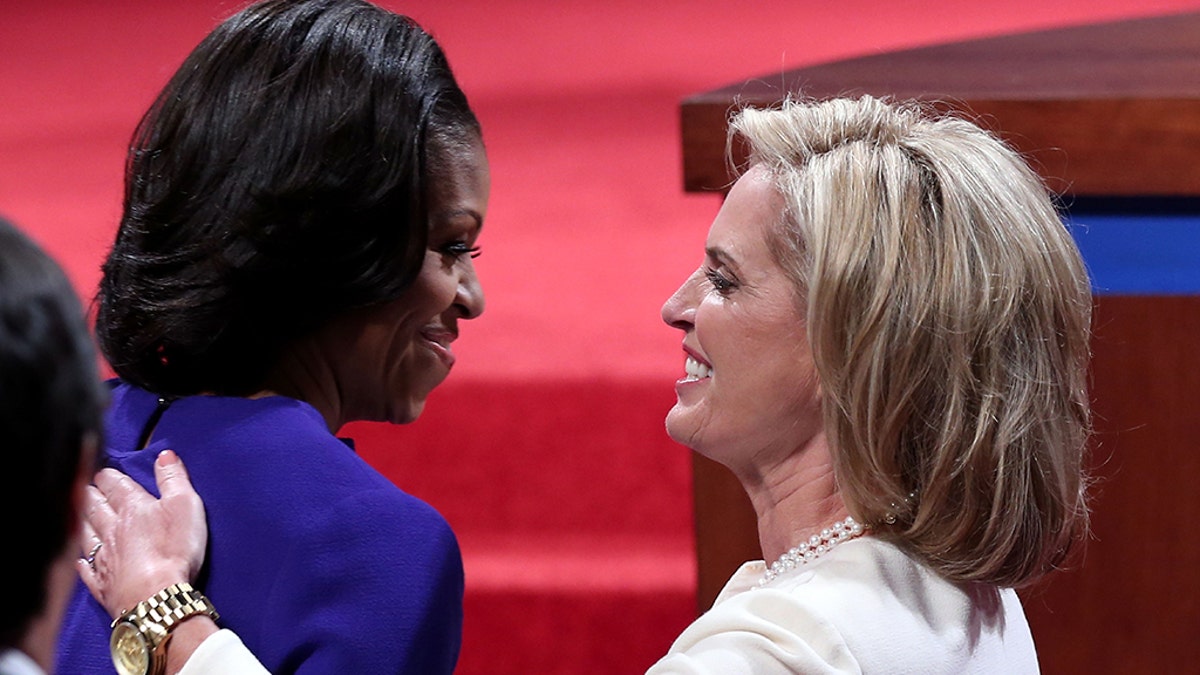 Ann Romney, right, wife of Republican presidential candidate, former Massachusetts Gov. Mitt Romney (not pictured), and first lady Michelle Obama hug prior to the presidential debate at the University of Denver on October 3, 2012, in Denver, Colo. Photo by Win McNamee/Getty Images)