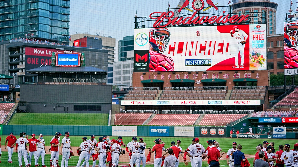 Cardinals beat Brewers, both clinch postseason berths –