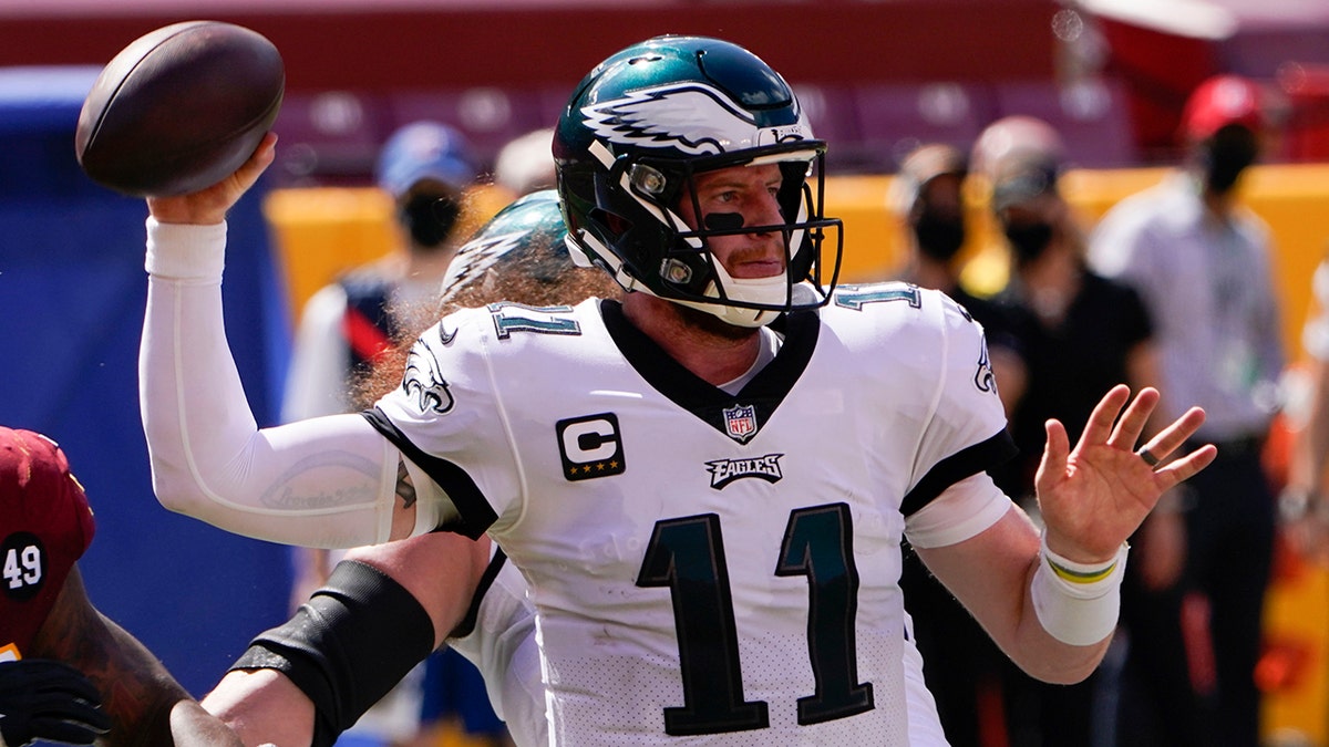 Philadelphia Eagles quarterback Carson Wentz looks to pass the ball against the Washington Football Team during the first half of an NFL football game, Sunday, Sept. 13, 2020, in Landover, Md. (AP Photo/Susan Walsh)