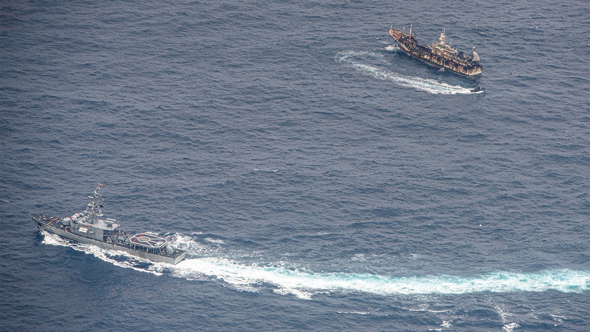 Ecuadorian Navy vessels surround a fishing boat after detecting a fishing fleet of mostly Chinese-flagged ships in an international corridor that borders the Galapagos Islands' exclusive economic zone, in the Pacific Ocean, August 7, 2020. Picture taken August 7, 2020. REUTERS/Santiago Arcos - RC2EAI9QEFR7