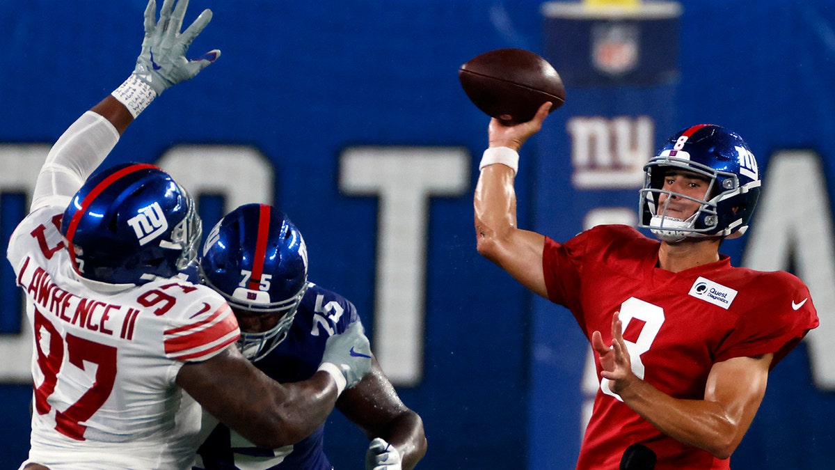 New York Giants quarterback Daniel Jones (8) passes during a scrimmage at the NFL football team's training camp in East Rutherford, N.J., Friday, Aug. 28, 2020. (AP Photo/Adam Hunger)