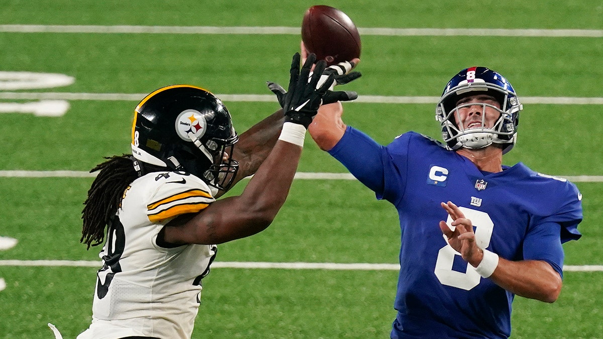 New York Giants quarterback Daniel Jones (8) throws under pressure from Pittsburgh Steelers outside linebacker Bud Dupree (48) during the third quarter of an NFL football game Monday, Sept. 14, 2020, in East Rutherford, N.J. (AP Photo/Seth Wenig)