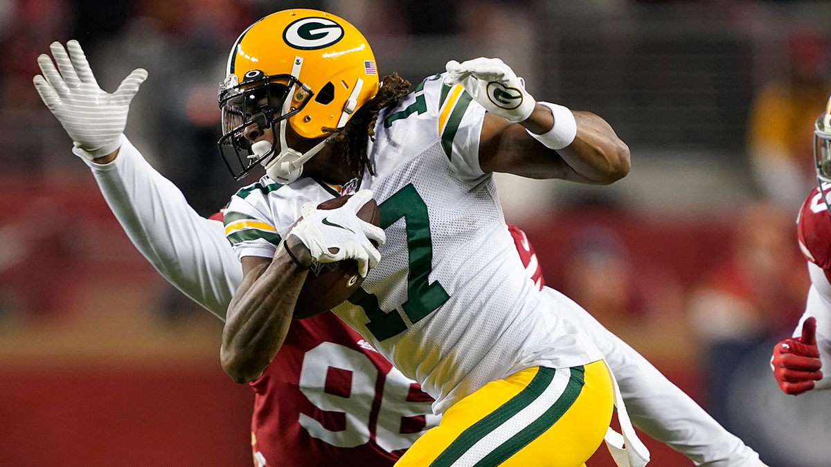 Green Bay Packers wide receiver Davante Adams (17) runs in front of San Francisco 49ers defensive tackle Sheldon Day during the second half of the NFL NFC Championship football game in Santa Clara, Calif. (AP Photo/Tony Avelar, File)