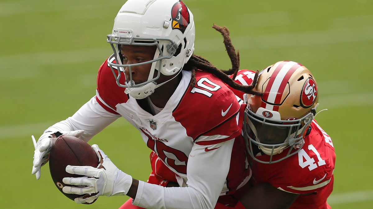 Arizona Cardinals wide receiver DeAndre Hopkins (10) catches a pass against San Francisco 49ers cornerback Emmanuel Moseley (41) during the first half of an NFL football game in Santa Clara, Calif., Sunday, Sept. 13, 2020. (AP Photo/Josie Lepe)