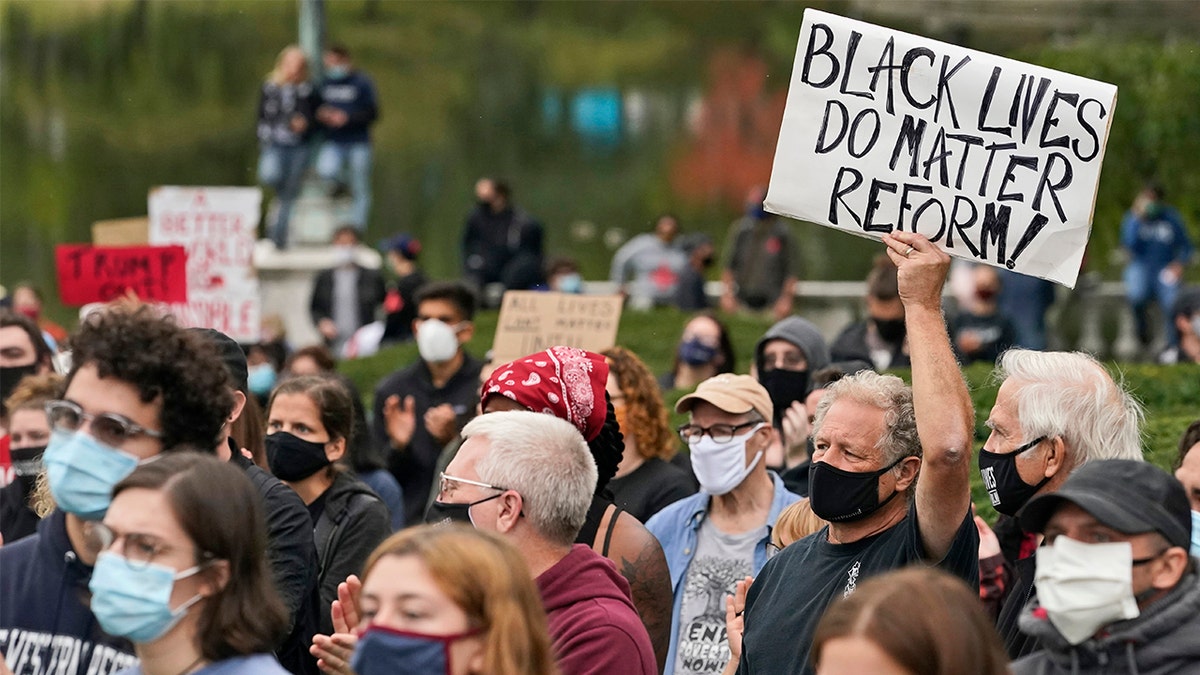 Protesters attend a rally near the debate hall, Tuesday, Sept. 29, 2020, in Cleveland. The first presidential debate between Republican candidate President Donald Trump and Democratic candidate and former Vice President Joe Biden is being held in Cleveland Tuesday. (AP Photo/Tony Dejak)