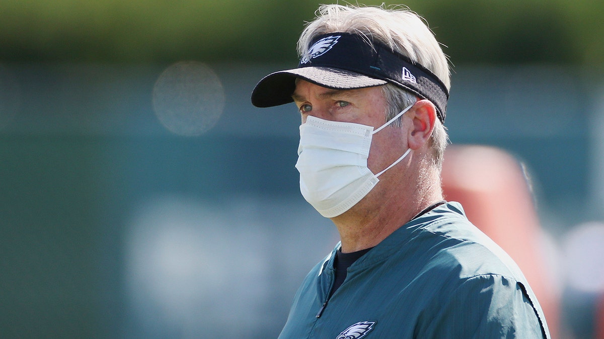 Philadelphia Eagles head coach Doug Pederson observes NFL football training camp at the team's practice facility, Wednesday, Aug. 26, 2020, in Philadelphia. (Tim Tai/The Philadelphia Inquirer via AP, Pool)